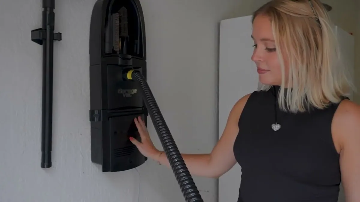 UltraVac mounted on a wall with its hose